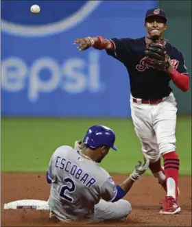  ?? DAVID DERMER — THE ASSOCIATED PRESS ?? The Indians’ Francisco Lindor turns a double play against the Royals in the seventh inning.