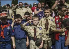  ??  ?? In this May 29 file photo, Boy Scouts and Cub Scouts salute during a Memorial Day ceremony in Linden, Mich. JAKE MAY/THE FLINT JOURNAL - MLIVE.COM VIA AP