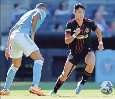  ?? Brad Penner/USA TODAY Sports ?? Atlanta United midfielder Luiz Araujo (19) controls the ball against New York City FC defender Alexander Callens (6) during the first half at Yankee Stadium on July 3.