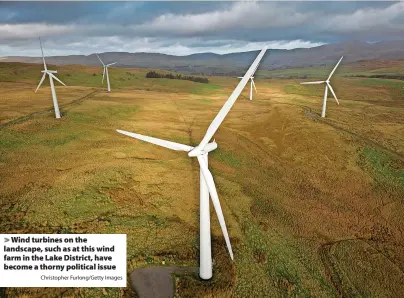  ?? Christophe­r Furlong/Getty Images ?? Wind turbines on the landscape, such as at this wind farm in the Lake District, have become a thorny political issue