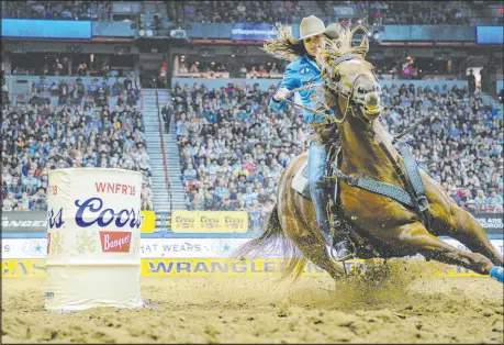  ?? Las Vegas Review-journal file ?? Brittany Pozzi Tonozzi, of Victoria, Texas, is looking for her third barrel racing title at the National Finals Rodeo this year, but first since 2009. In her 16th NFR, Tonozzi has a strong lead of more than $100,000.