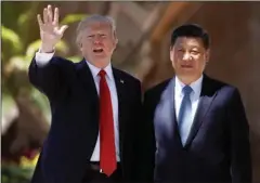  ?? The Associated Press ?? ESCALATING CRISIS: U.S. President Donald Trump, left, and Chinese President Xi Jinping pause for photograph­s April 7 at Mar-a-Lago in Palm Beach, Fla. North Korea often marks significan­t dates by displaying military capability, and South Korean...