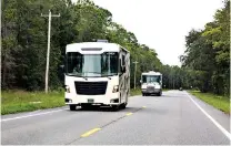  ?? Patrick Connolly/Orlando Sentinel/TNS ?? ■ RVs travel along one of Florida’s state roads on Aug. 20, 2020. Millions of Americans have traveled by RV amid the pandemic.
