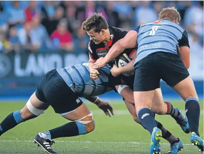  ?? Getty Images. Picture: ?? Edinburgh’s Chris Dean is tackled by Cardiff Blues pair Rhys Gill and Seb Davies, part hidden, as Richard Cockerill’s side get their PRO14 campaign off to a winning start.