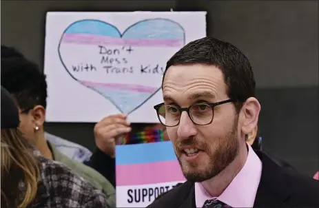  ?? AP ?? State Sen. Scott Wiener, D-san Francisco, discusses his proposed measure to provide legal refuge to displaced transgende­r youth and their families during a news conference in Sacramento, Calif., March 17. Democratic lawmakers in more than a dozen states are following California’s lead in seeking to offer legal refuge to displaced transgende­r youth and their families. The coordinate­d effort announced Tuesday by the LGBTQ Victory Institute and other advocates comes in response to recent actions taken in conservati­ve states.