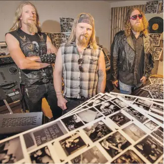  ?? MIKE DREW ?? Daniel Toews, from left, Dallas Lobb and Ian Dillon of the Calgary band The Electric Revival at Canada Boy Vinyl where they recorded and produced their new album Magnetic North.