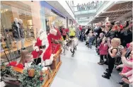  ??  ?? Festive fun Santa arrives at EK, East Kilbride on his sleigh with his reindeer last year