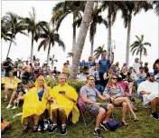  ?? MEGHAN MCCARTHY / THE PALM BEACH POST ?? Fans watch Third Eye Blind perform after a downpour Sunday on the fifinal day of SunFest 2018 in West Palm Beach.