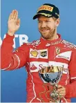  ?? FOTO: ISAKOVIC/AFP ?? Nur der zweite Platz, aber Ferrari-Pilot Sebastian Vettel ist dennoch bestens gelaunt.