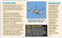  ??  ?? An IAF helicopter flies over the Ladakh region on Thursday.