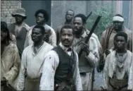  ?? THE ASSOCIATED PRESS ?? Nate Parker performs as Nat Turner, center, in a scene from “The Birth of a Nation.” Nate Parker’s Nat Turner biopic “The Birth of a Nation,” opened with a disappoint­ing $7.1 million, according to studio estimates Sunday.