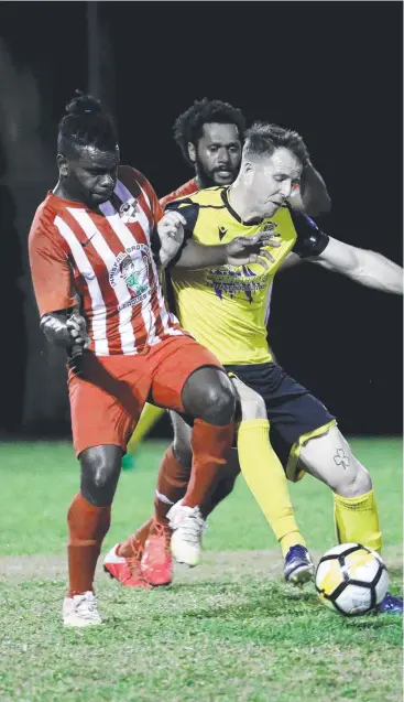  ?? Picture: STEWART McLEAN ?? AT HOME: Edge Hill United’s Crios O’Hare, battles Innisfail’s Nilua Iaukou for possession. The player/ coach is in hot form with the boot to start the FNQ Premier League season.