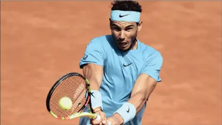  ??  ?? POWER PLAY: Spain’s Rafael Nadal returns during his semi-final win over Argentina’s Juan Martin Del Potro at Roland Garro yesterday.