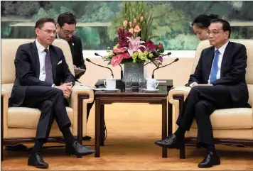  ?? PHOTO: REUTERS ?? European Commission Vice President Jyrki Katharine (left) attends a meeting with China’s Premier Li Keqiang at the Great Hall of the People in Beijing, China yesterday.