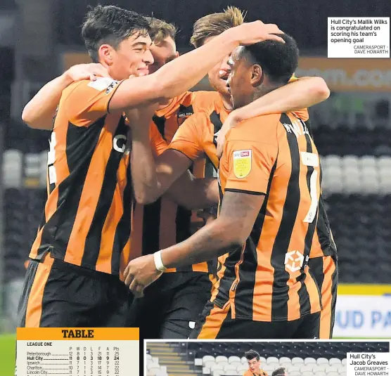  ?? CAMERASPOR­T - DAVE HOWARTH ?? Hull City’s Mallik Wilks is congratula­ted on scoring his team’s opening goal