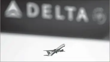  ?? File, David Goldman / AP ?? Atlanta-based Delta Air Lines finds itself at odds with the state of Georgia for its move to revoke a special discount for National Rifle Associatio­n members.