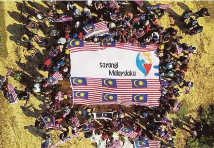  ?? PIC BY GHAZALI KORI ?? The year’s Merdeka celebratio­ns are a watershed moment for Malaysians who proved that democracy works — the nation came together and voted for a change in government.