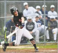  ?? Erik Trautmann / Hearst Connecticu­t Media ?? Ridgefield’s Robert Arent takes a cut at the ball against Staples on Friday.