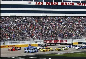  ?? CHASE STEVENS — THE ASSOCIATED PRESS ?? Cars round the track during a Monster Energy Cup Series race Feb. 23at Las Vegas Motor Speedway.