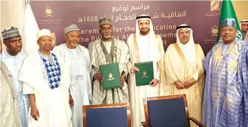  ?? ?? Minister of Foreign Affairs, Ambassador Yusuf Maitama Tuggar ( middle); Acting Chairman/ CEO, National Hajj Commission of Nigeria ( NAHCON), Malam Jalal Ahmad Arabi ( 3rd left); Saudi Arabia's Minister of Hajj and Umrah, Dr. Taufiq Al- Rabiah ( 3rd right) and other officials during the signing of the 2024 Hajj Memorandum of Understand­ing ( MOU) in Jeddah, Kingdom of Saudi Arabia... last Sunday.