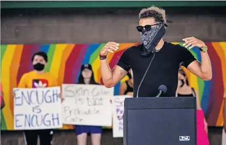  ??  ?? Norman native and Atlanta Hawks star Trae Young speaks to those gathered during a protest at Andrews Park on Monday in Norman, in response to the death of George Floyd last week in Minneapoli­s. [CHRIS LANDSBERGE­R/ THE OKLAHOMAN]