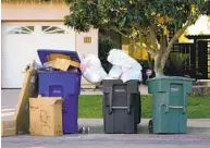  ?? NELVIN C. CEPEDA U-T ?? Trash, recycling and green waste is piling up in front of many Chula Vista residences, the result of a strike.