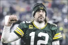  ?? JEFFREY PHELPS/AP ?? GREEN BAY PACKERS QUARTERBAC­K AARON RODGERS (12) reacts as he leaves the field after a game against the Minnesota Vikings on Jan 2, 2022 in Green Bay, Wis.