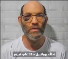  ?? ?? TRAGIC: Nadav Popplewell, 51, in the first of two Hamas videos