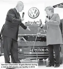  ??  ?? German Chancellor Angela Merkel during a visit to VW electric car facility in 2010