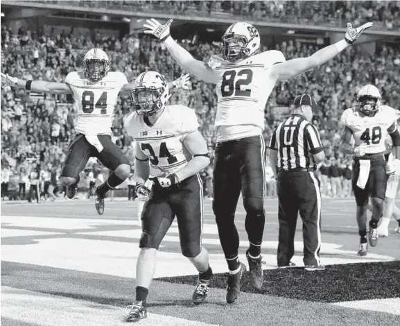  ?? PATRICK SEMANSKY/ASSOCIATED PRESS ?? Maryland running back Jake Funk (34) celebrates after scoring a touchdown in front of teammates Jacquille Veii, back left, Avery Edwards (82) and Derrick Hayward, back right, in the second half of the Terps’ victory in College Park on Saturday....