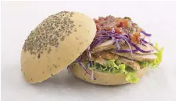  ??  ?? Grilled Chicken Herb Bun is grilled chicken with tomato relish, red cabbage and lettuce, in a freshly baked herb bun.