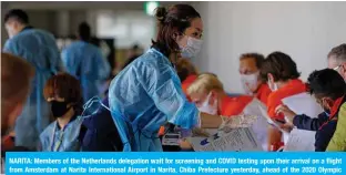  ?? — AFP ?? NARITA: Members of the Netherland­s delegation wait for screening and COVID testing upon their arrival on a flight from Amsterdam at Narita Internatio­nal Airport in Narita, Chiba Prefecture yesterday, ahead of the 2020 Olympic Games in Tokyo.