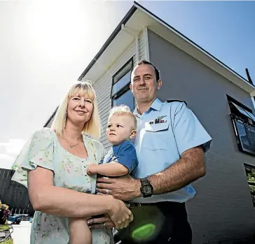  ?? LAWRENCE SMITH/STUFF ?? Sean and Dianne Donaldson pictured with their 19-month-old son Joshua outside their new home close to the Whenuapai air force base, north of Auckland.