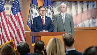  ?? ?? Speaker of the House Mike Johnson, R-La., left meets with reporters ahead of a crucial vote on a continuing resolution to keep the government funded at its current levels on Tuesday.