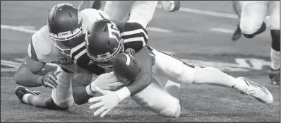  ?? AP/ TONY GUTIERREZ ?? Arkansas defensive back Santos Ramirez ( left) knocks the ball loose from Texas A& M receiver Christian Kirk in last Saturday’s game. Ramirez was also in on two tackles that might have saved touchdowns, according to Arkansas defensive backs coach Paul...