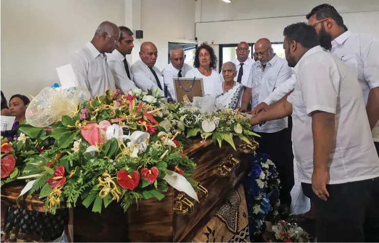  ?? Photo: Laiseana Nasiga ?? Goundar and Murgan family members surroundin­g the casket of the late Joseph Michael Pugan as they bid their final farewell before Mr Pugan was cremated at Dignified Cremations in Davuilevu on February 4, 2020.