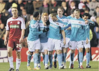  ??  ?? Sunderland, in blue shirts, celebrate a goal during their last visit to Middesbrou­gh in 2012.