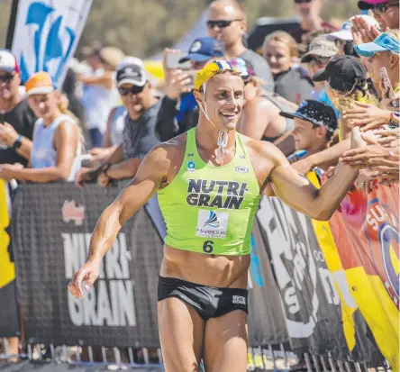  ??  ?? Surfers Paradise winner Matt Bevilacqua shares the moment with fans. And (below from left) men’s competitor­s in the surf; Courtney Hancock powers along the beach and the men strive to do the same. Pictures: JERAD WILLIAMS