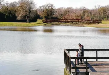  ?? Melissa Phillip / Staff photograph­er ?? Sensors and pumps in lakes such as Cypress Lake in Bridgeland are one of many flood-mitigation solutions proposed.