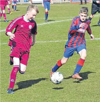  ??  ?? Kirrie Thistle U/14 (maroon) emphatical­ly saw off Dundee West 6-3 to win the Dundee West Anniversar­y Cup at North End Park.