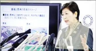  ??  ?? Tokyo Gov Yuriko Koike speaks during a press conference at Tokyo Metropolit­an City Hall in Tokyo on June 20. Koike said the giant Tsukiji fish market, popular with tourists, will stay, although it will get modernized and developed within five years. (AP)