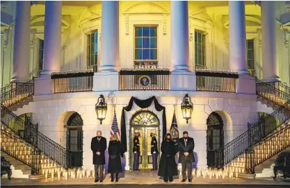  ?? DOUG MILLS THE NEW YORK TIMES ?? President Joe Biden, first lady Jill Biden, Vice President Kamala Harris and second gentleman Doug Emhoff attend a memorial Monday at the White House to honor the lives lost to COVID-19 as the United States surpassed a half-million deaths.