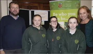  ??  ?? Edmund Joyce and Julie Mulligan with Presentati­on Wexford students, Laura Kavanagh, Chloe Fortune and Jessica Quaid at the Tourism and Event Management display.