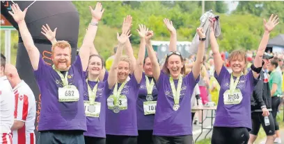  ??  ?? Pinches Medical Centre staff with their medals after completing the Alderley Edge Bypass 10k