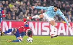  ?? AFP ?? Manchester City’s Ilkay Gundogan, right, vies with Basel’s Taulant Xhaka.