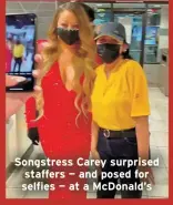  ?? ?? Songstress Carey surprised staffers — and posed for selfies — at a McDonald’s