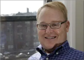  ?? ELISE AMENDOLA- THE ASSOCIATED PRESS ?? In this April 15, 2015, file photo, former Boston University hockey player Travis Roy poses in his apartment in downtown Boston. Roy, who was paralyzed 11seconds into his first game and went on to beamotivat­ional speaker and advocate for the disabled, has died. Hewas45.