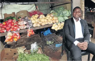  ?? /VELI NHLAPO ?? Actuarial science graduate Tsietsi Ngobese has chosen to continue selling fruit and vegetables in Katlehong while he develops his mathematic­s tutoring programme.