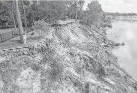  ?? Mark Mulligan / Houston Chronicle ?? Malcolm and Beverly Gerber have been watching their property along the Brazos River in Richmond quickly disappear due to major flood events. The high-water levels after Hurricane Harvey left them with even less land behind their home.