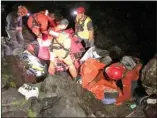  ?? Central Okanagan Search and Rescue ?? Members of Central Okanagan Search and Rescue help a Quebec man in his 20s who was injured on a rope swing Sunday at Christie Falls.